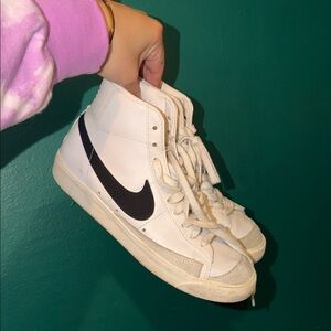 White High-Top Nike Sneakers with Black Swoosh - Women's